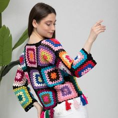 Multicolor Knit Crochet Top For Fall, Multicolor Crochet Top For Winter, Trendy Winter Crochet Top, Fall Multicolor Crochet Knit Top, Black Bohemian Sweater With Crochet Details, Black Bohemian Crochet Sweater, Winter Bohemian Crochet Top With Crew Neck, Fall Multicolor Hand Knitted Crochet Top, Multicolor Crochet Long Sleeve Top