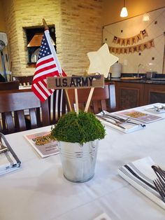 the table is set with an american flag centerpiece