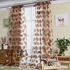 a living room filled with furniture and curtains