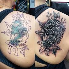 two pictures of different tattoos on the back of women's bodies, one with flowers