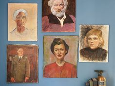 four portraits of people are on the wall