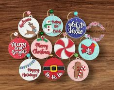 christmas ornament ornaments on a wooden table with candy and snowman, santa clause, happy holidays