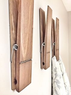 two wooden hooks are attached to the wall