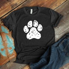 a t - shirt with an image of a dog's paw printed on it