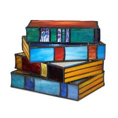 three multicolored stained glass boxes stacked on top of each other