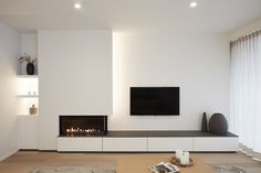 modern living room with fireplace and flat screen tv