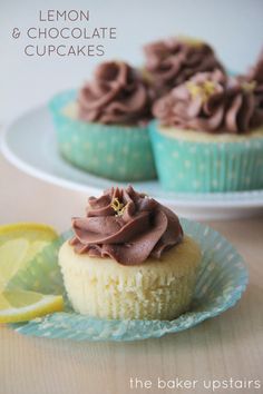 two lemon cupcakes with chocolate frosting on top