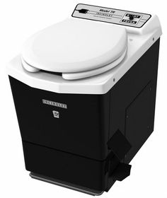 a white toilet sitting on top of a black box