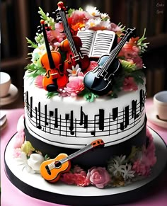 a cake decorated with musical instruments and flowers