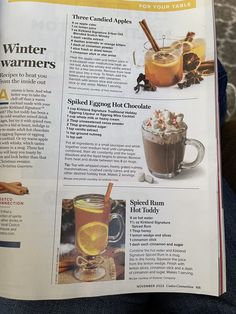 an article in a magazine about winter warmers and hot drinks on someone's lap