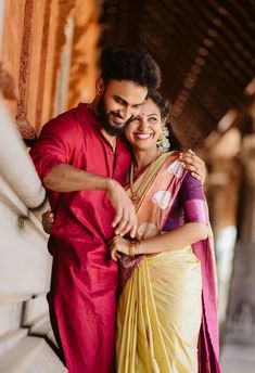 a man and woman standing next to each other