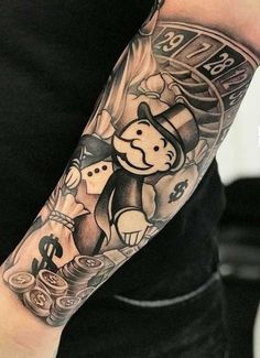 a man with a clock and monkey tattoo on his arm