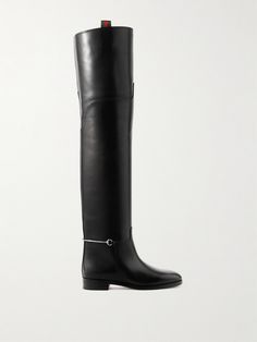 Since taking the reigns as Creative Director, Sabato De Sarno has continued to embrace Gucci's equestrian heritage. These boots are inspired by classic riding styles and caught eyes on the Fall '24 runway with their over-the-knee design. They're crafted from glossy leather and have signature horsebit hardware in place of stirrups. Gucci Long Boots, Gucci Horsebit Boot, Designer Black Boots With Horsebit Detail, Leather Gucci Boots With Horsebit Detail, Gucci Equestrian Boots, Luxury Designer Black Knee-high Boots, Luxury Black Leather Knee-high Boots, Leather Over The Knee Boots, Gucci Horsebit