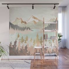 a wall mural with mountains and trees painted on it's side in a living room