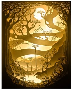 an intricate paper cut artwork depicting trees and mountains