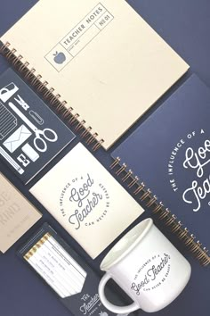 various stationery items including notebooks and coffee mug