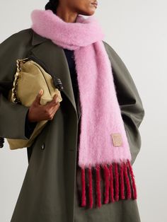 Loewe's scarf is the ideal antidote to wintry days - it's knitted from mohair-blend with plenty of wool in the mix for a warm and fluffy feel. It's detailed with a leather patch bearing the label's heritage 'Anagram' logo and is long enough to wrap around your neck twice. Loewe Scarf, Magenta Scarf, Fuzzy Scarf, Ferragamo Bag, Mohair Scarf, Exclusive Dress, Sport Swimwear, Sports Skirts, Dress Trousers