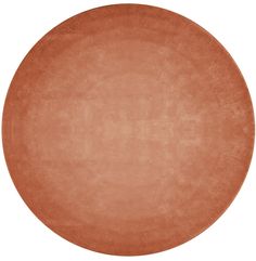 an orange round rug on a white background