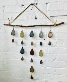 Unique ceramic wall art using individually made and decorated earthenware raindrop shapes, pressed with a flora pattern and glazed with 5 different glazes within the blue/green colour spectrum. The pieces are joined together with wire and hang from a locally sourced branch. A length of rope secured with a cow hitch knot allows you to hang the piece in your chosen space. This is a tactile, interactive and playful piece which will be a talking point for anyone who owns it. A living art piece to bring joy and positivity to your home. Hitch Knot, Colour Spectrum, Flora Pattern, Pottery Patterns, Tree Of Life Wall, Ceramic Wall Art, Living Art, Workshop Ideas, Unique Ceramics