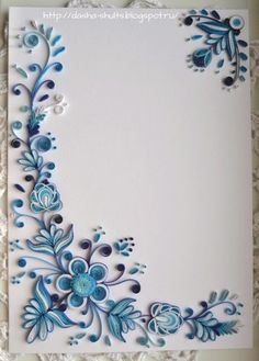 a white card with blue flowers on it