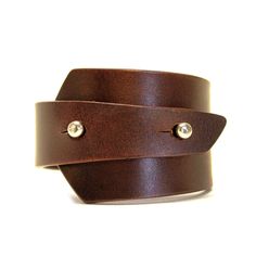 Unisex handcrafted leather bracelet, made from high quality genuine Italian leather. Bracelet has a unique asymmetrical shape, closes with two metal button head studs. Bracelet width in the widest place is 5 cm, leather thickness is about 3,5 mm. This genuine leather is very high quality, can be worn for many years. Comes in our branded box, perfect for a gift. - SIZE GUIDE - In order to choose the right size measaure the circumference of your wrist. Choose the corresponding bracelet size accord Bracelet Man, Man Bracelet, Leather Ideas, Leather Wristbands, Bracelet Mens, Wide Bracelet, Bracelet Men, Bracelet Leather, Leather Cuffs Bracelet