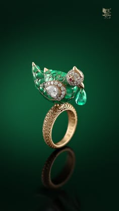 A beautifully crafted parrot ring crafted with emeralds, diamonds and rubies in stunning filigree work. Creations such as this and more take you to the world of the legendary Nizams. Only at Sri Krishna Jewellers, Road No 10, Banjara Hills, Hyderabad. Instagram: @srikrishnajewellers visit our website at www.srikrishna.com For any further inquiries, please call us at +91 96399 96399 Nizam Jewellery, Solitaire Ring Designs, Luxury Diamond Jewelry, Real Diamond Necklace, Bridal Necklace Designs, Jewelry Knowledge, Exotic Jewelry, Fancy Jewelry Necklace