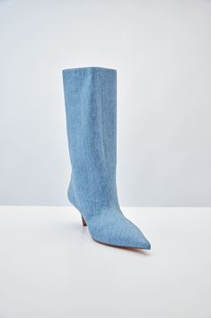 For Spring/Summer 2024, Amina Muaddi played with the idea of trompe l'œil by crafting a pair of thigh-high suede boots with a denim print. Spring Denim Knee-high Boots, Spring Knee-high Denim Boots, Denim Knee-high Boots For Spring, Fitted Denim Blue Boots For Fall, Denim Summer Boots, Fitted Denim Summer Boots, Fitted Denim Boots For Summer, Fitted Denim Boots With Pointed Toe, Chic Denim Blue Boots For Fall