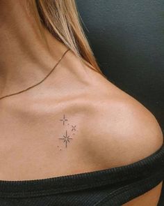 a woman with a small tattoo on her chest