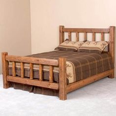 a wooden bed frame with pillows on it