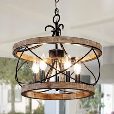 a wooden chandelier hanging from the ceiling