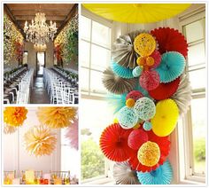 an assortment of colorful paper flowers and decorations in various stages of being hung from the ceiling