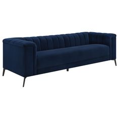 a blue velvet sofa with black legs