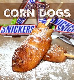 some kind of food that is on top of a table with the words snickkers corn dogs