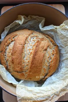 a loaf of bread sitting in a bowl