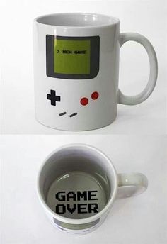 two coffee mugs with game over designs on them