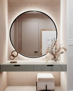 a round mirror on the wall above a dressing table