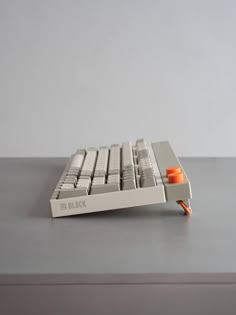 a computer keyboard sitting on top of a table