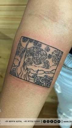 a person with a tattoo on their arm that has an image of the starry night