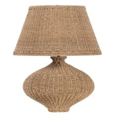 a lamp that is made out of wicker and has a beige shade on it