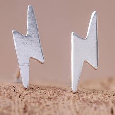 Crafted of sterling silver with a high-polish finish two lightning bolt shapes adorn the ears with beauty. Wadarat Supasirisuk presents this pair of stud earrings crafted by local artisans from Thailand. Electric Energy, Silver Ear Cuff, Sterling Silver Stud Earrings, Earring Crafts, Silver Stud Earrings, Lightning Bolt, Artisan Craft, Jewelry Packaging, Sterling Silver Studs