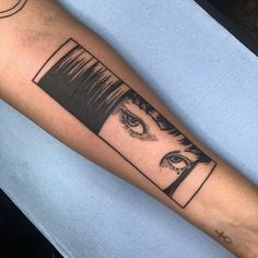 a woman's arm with a black and white tattoo design on the left forearm