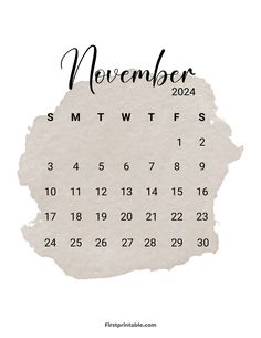 a white calendar with the word november written in black ink on it, and an image of