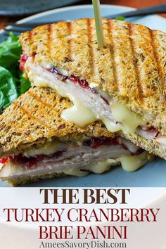 the best turkey cranberry brie panini is on a plate with lettuce