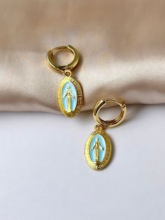 Are you looking for the perfect Virgin Mary hoops for someone special this summer? Or a unique pair of Our Lady of Guadalupe earrings to spoil yourself? Made with tarnish-free stainless steel, bright enamel and plated with 18K gold, my tarnish-free Catholic earrings are the perfect compliment to any outfit idea! My 18K gold hoop earrings are a great gift idea for any special occasion to all the women in your life. You can't go wrong when gifting my delicate huggie hoop earrings to your bestie, w Virgin Mary Earrings, Catholic Earrings, Adult Baptism Gifts, Adult Baptism, Our Lady Of Guadalupe, Lady Of Guadalupe, Ringe Gold, Gold Signet Ring, Matching Rings