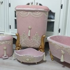 pink and gold bath tubs with matching footstools