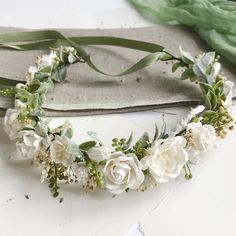 a white flower crown on top of a table