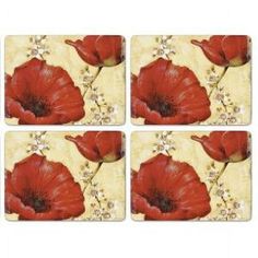 four square coasters with red flowers on the front and back, set of four