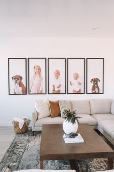 a living room filled with furniture and pictures on the wall above it's coffee table