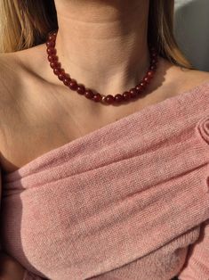 D E S C R I P T I O N :  This stunning handmade necklace is crafted from Carnelian beads, strung on a silk thread. Carnelian, known for its vibrant red hue, exudes warmth and vitality. The total length of the necklace is 15', making it the perfect accessory to add a pop of color and elegance to any outfit. S T O N E   M E A N I N G :   * Carnelian is a stone of energy, creativity, and courage. It is perfect for those who seek motivation, inspiration, and a bold, confident vibe. M A T E R I A L S : * Carnelian 10mm beads * Yellow 14K Gold Filled Corrugated Beads * Silk Thread * 24K Gold Plated Silver Clasp S I Z E   G U I D E :  The necklace is made of Silk Thread and Carnelian beads. It has a length of 15', with an extension of approximately 1.6'.  Please measure and check if it fits befor Chunky Beaded Necklace, Short Beaded Necklace, Chunky Bead Necklace, Red Beaded Necklaces, Chunky Bead Necklaces, Carnelian Necklace, Carnelian Beads, Chunky Beads, Red Bead