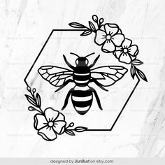 a black and white bee with flowers on it's back, in front of a hexagonal frame